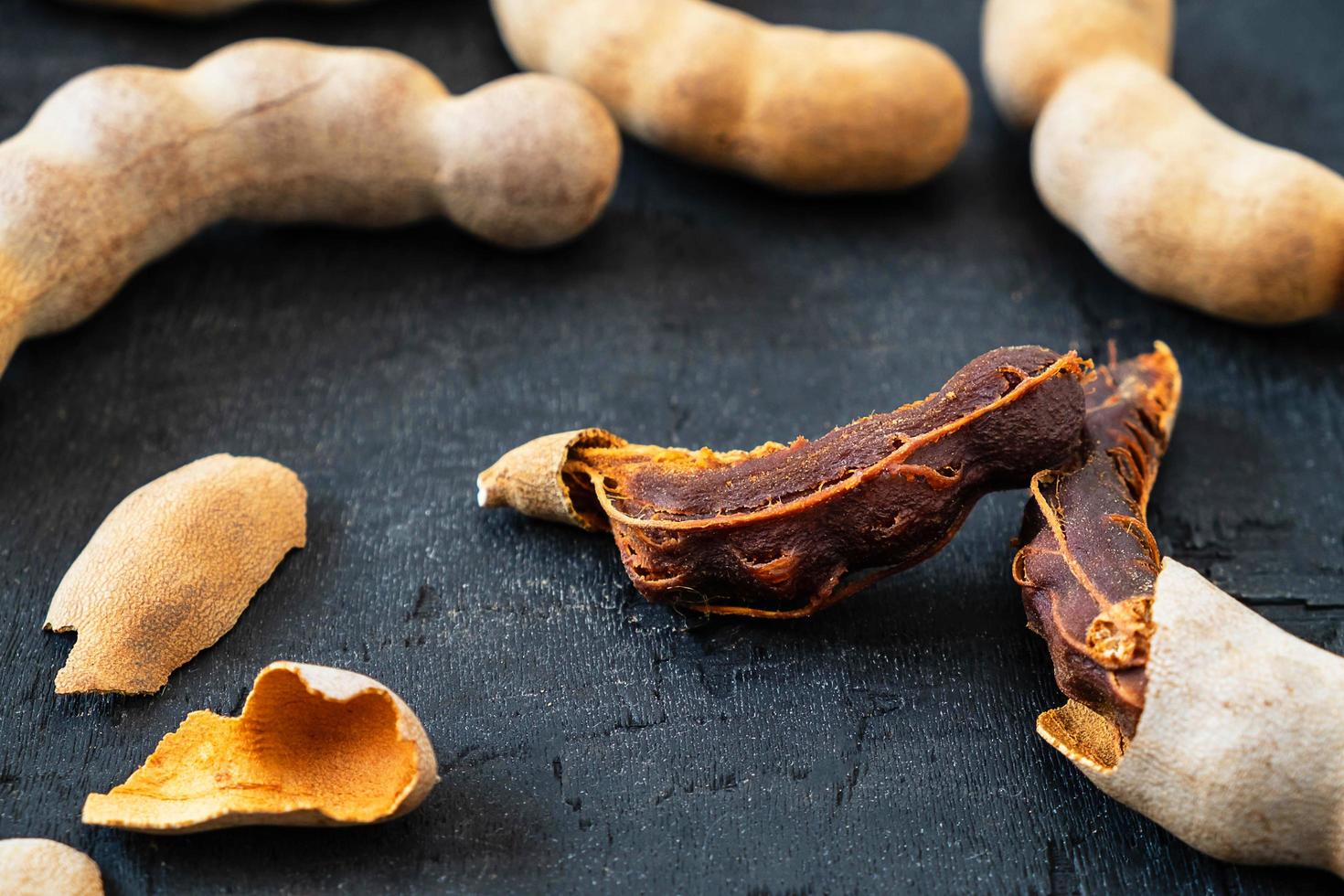 Fresh tamarind on a black background photo