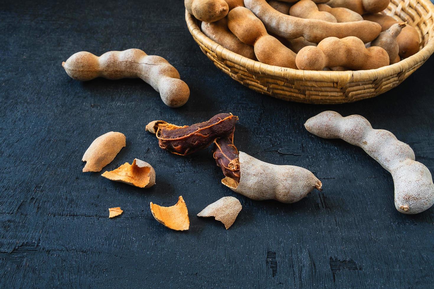 Tamarind on a black surface photo