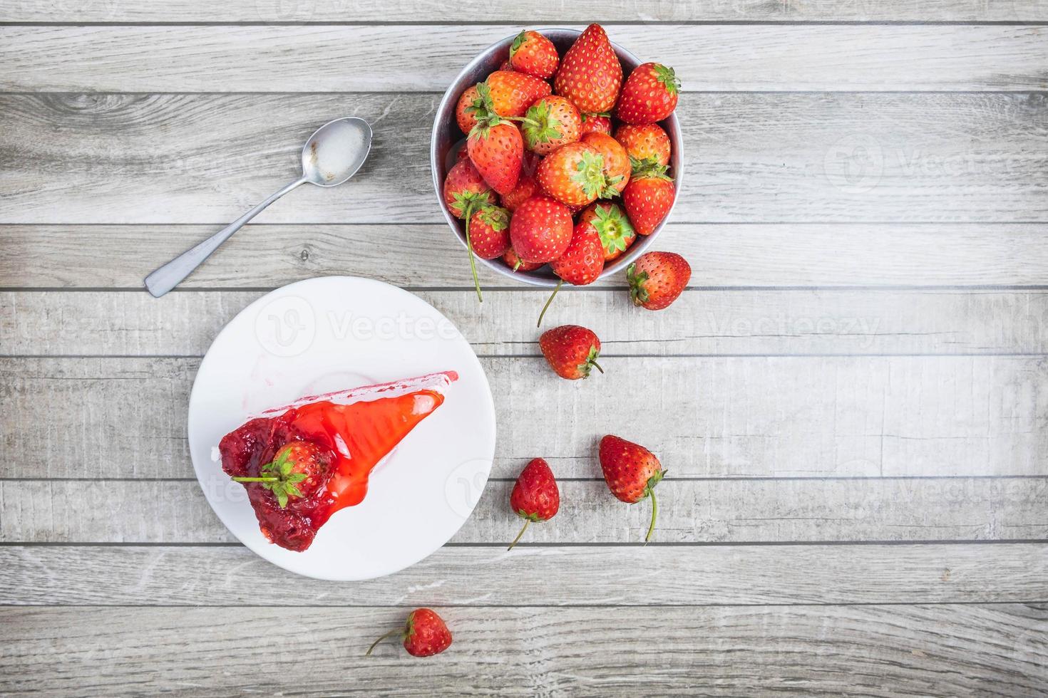 Cake on a plate with strawberries photo