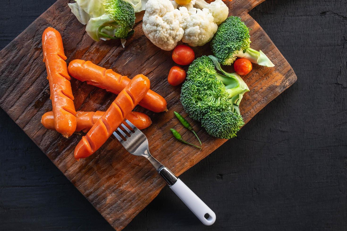 Cutting board with veggies photo