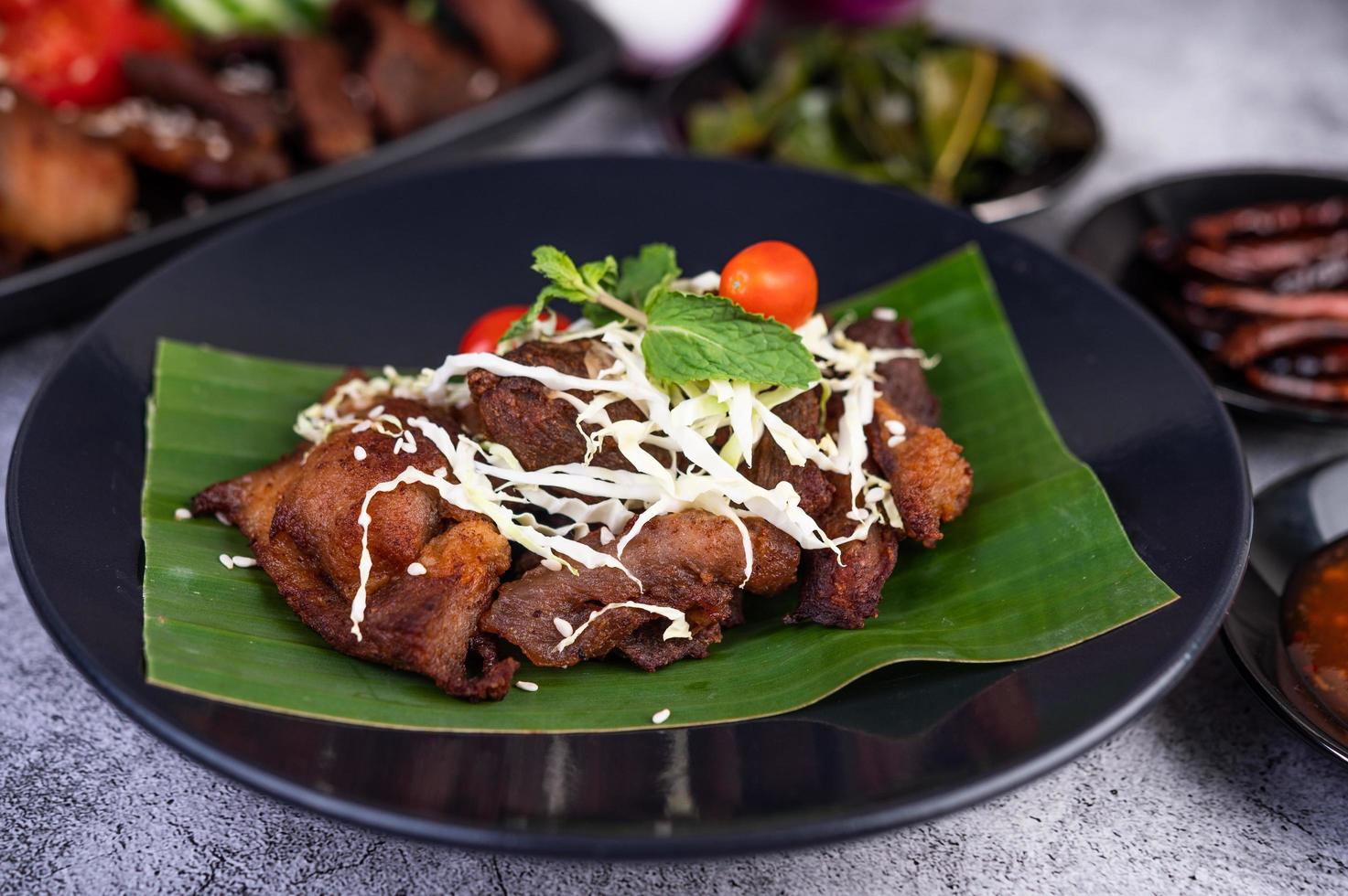 Fried pork topped with sesame seeds photo