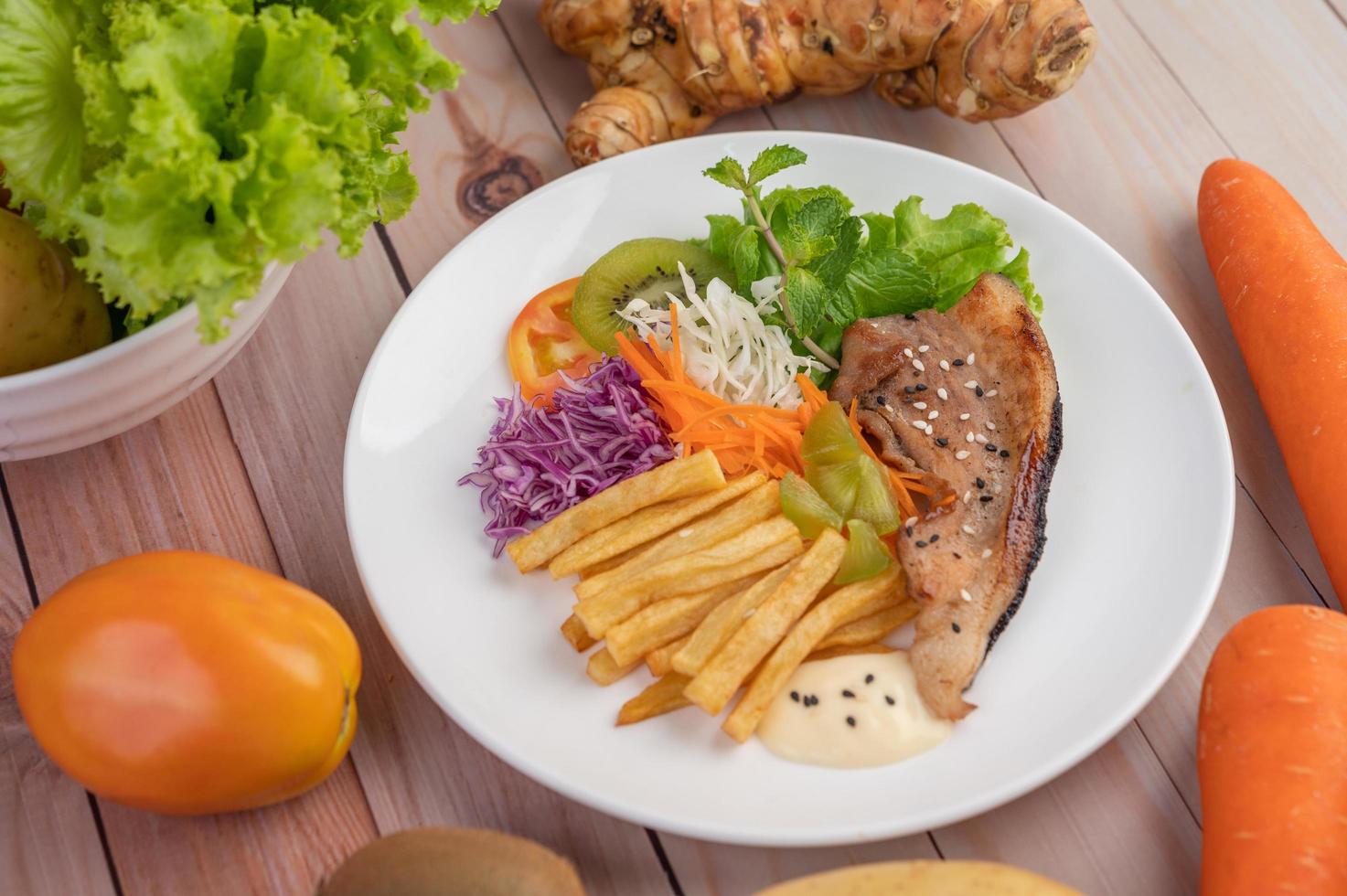 Fish with french fries and salad photo