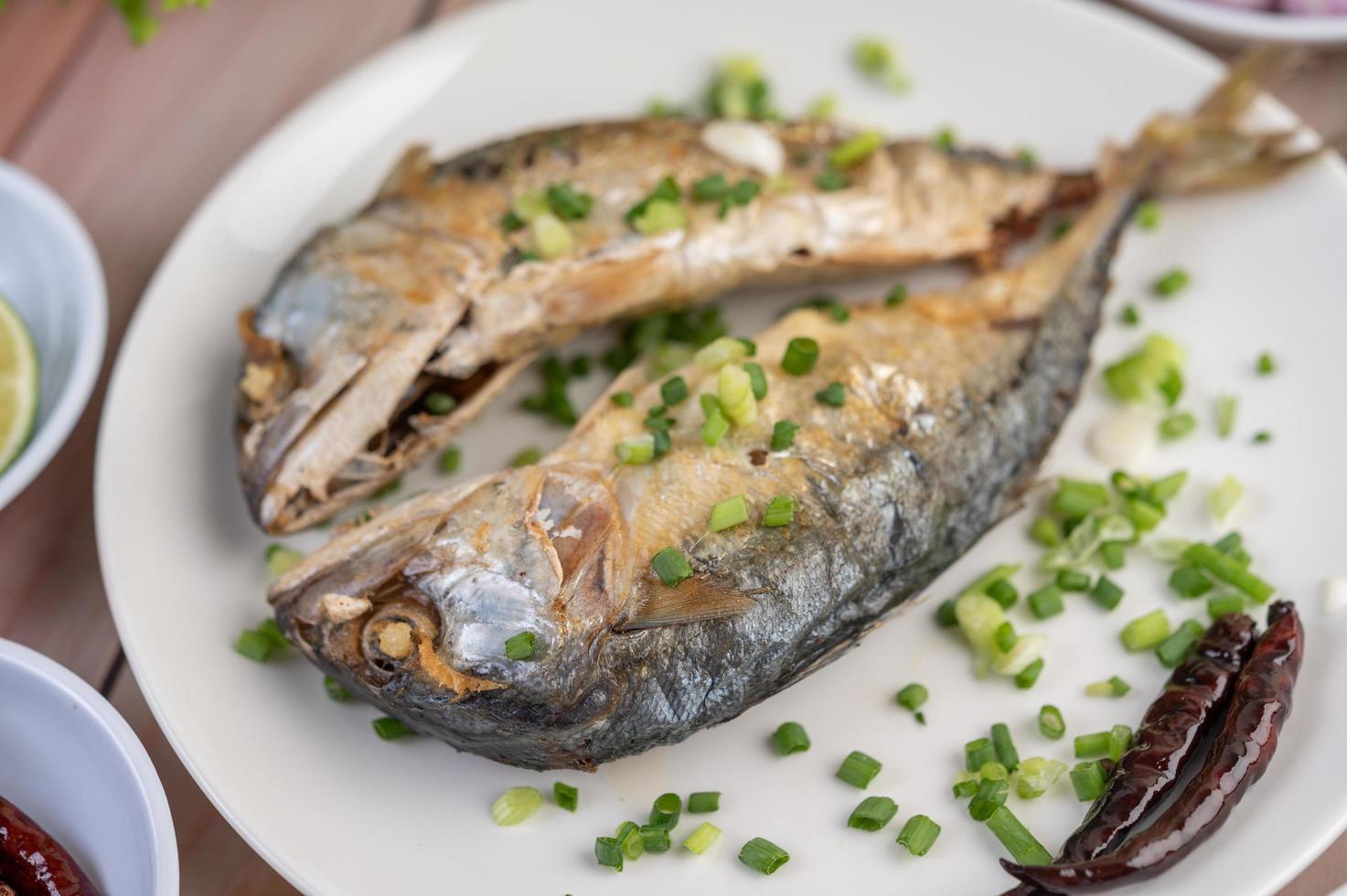 A plate of cooked mackerel photo