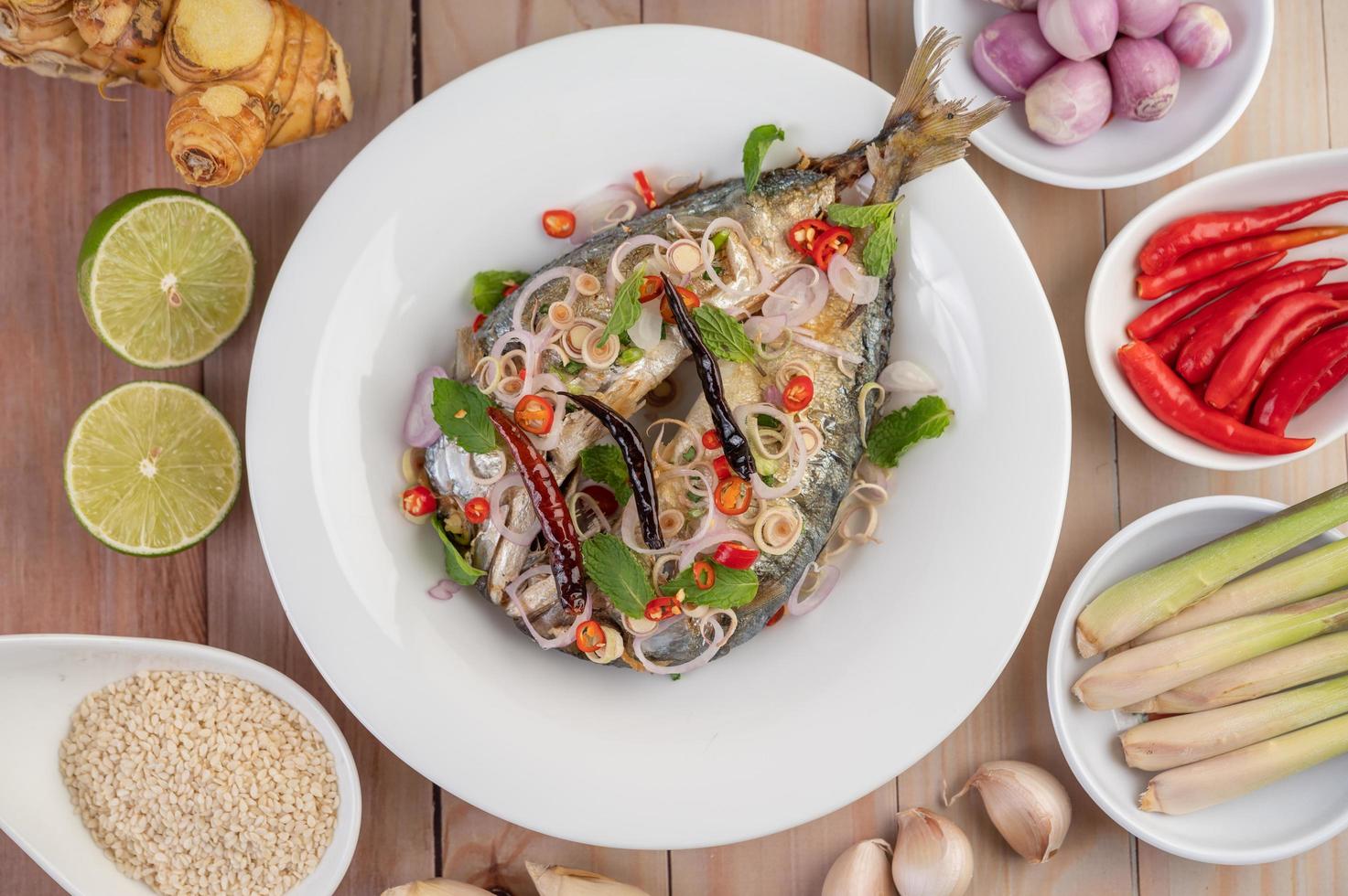 Deep-fried mackerel topped with pepper and mint photo