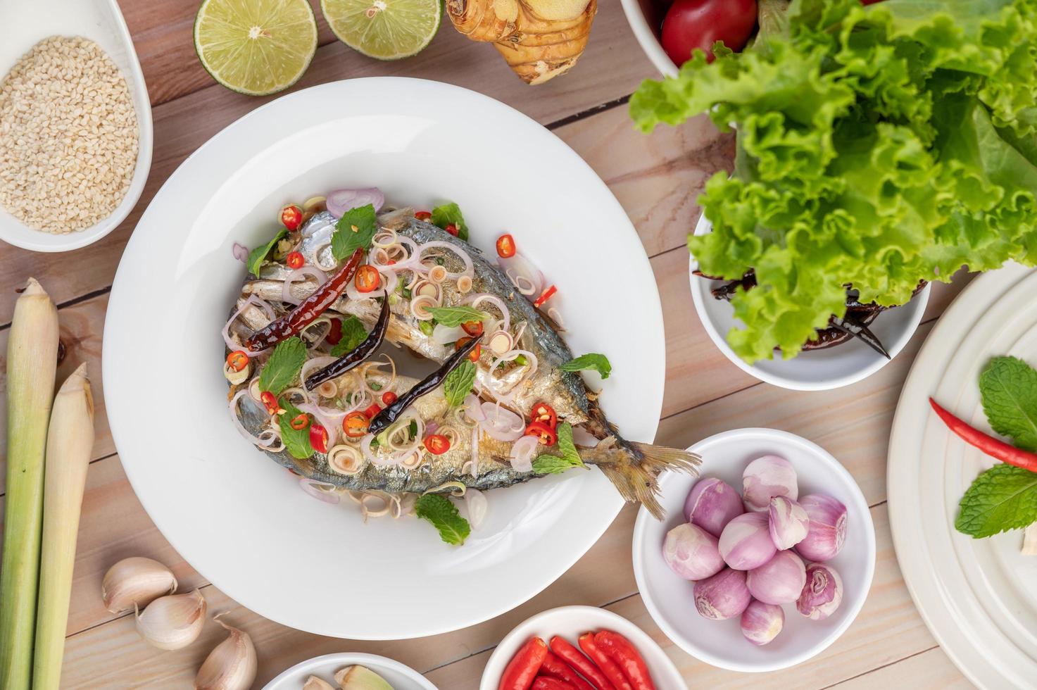 Deep-fried mackerel topped with pepper and mint photo