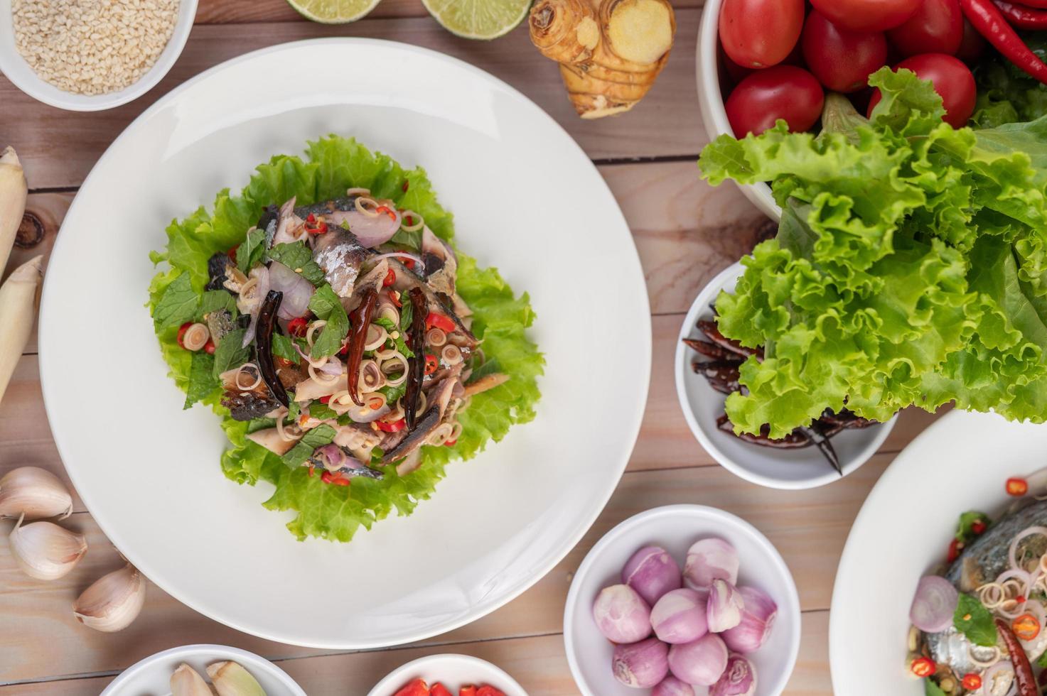 Deep-fried mackerel topped with pepper and mint photo