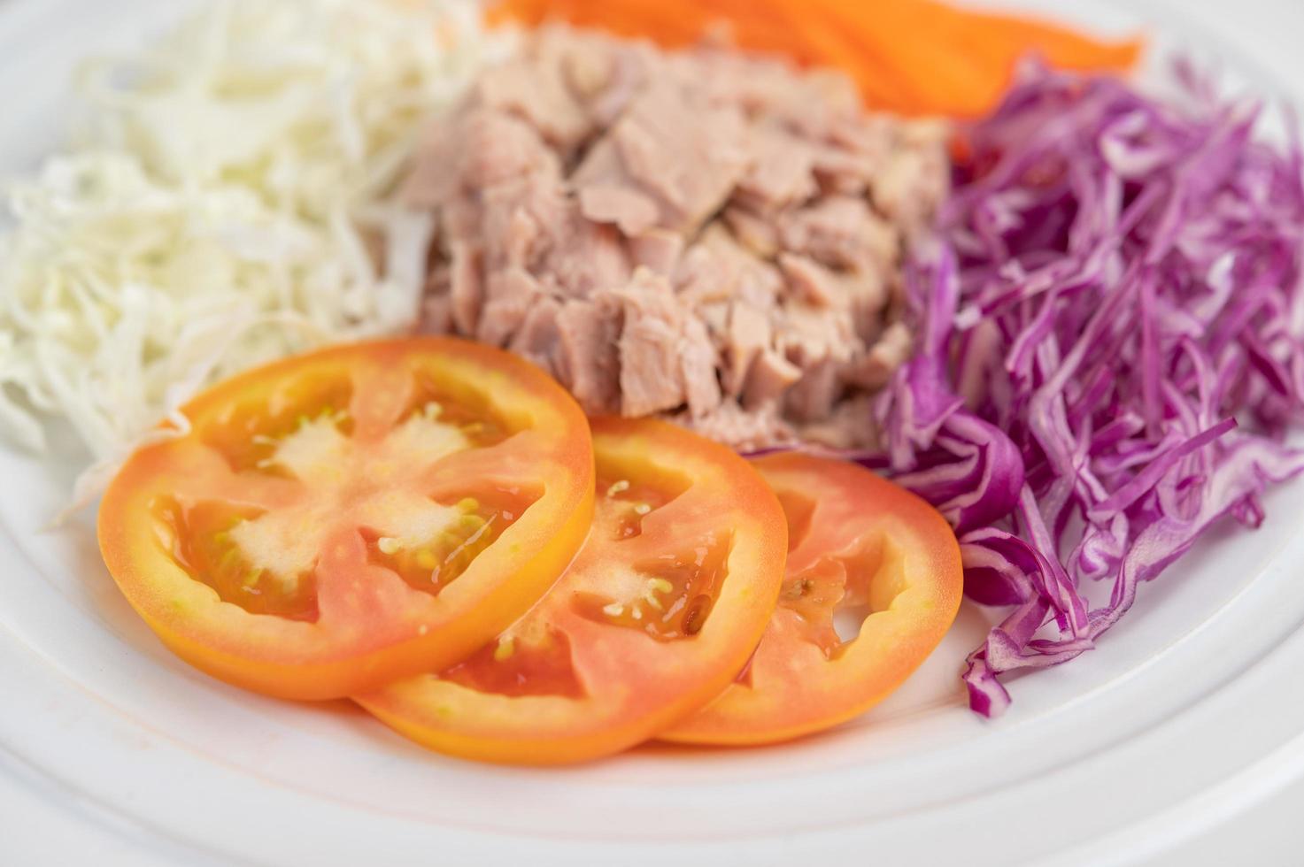 Tuna salad with carrots, tomatoes and cabbage photo