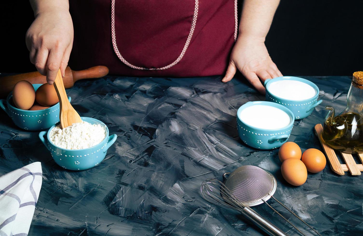 Person baking on a gray surface photo