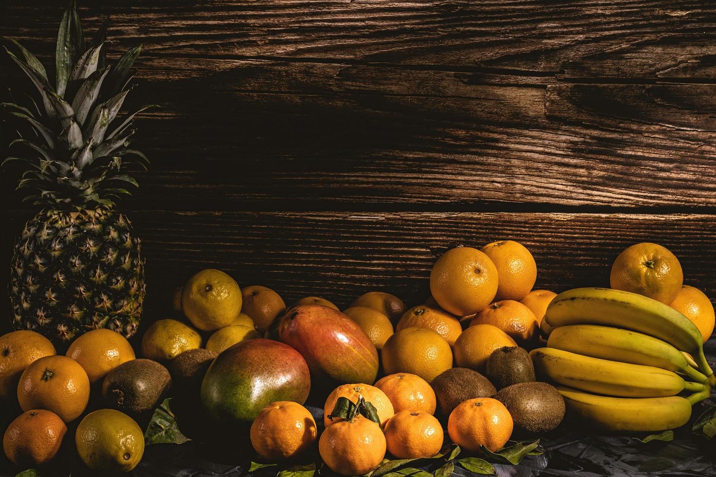 Yellow fruit on a wood background photo