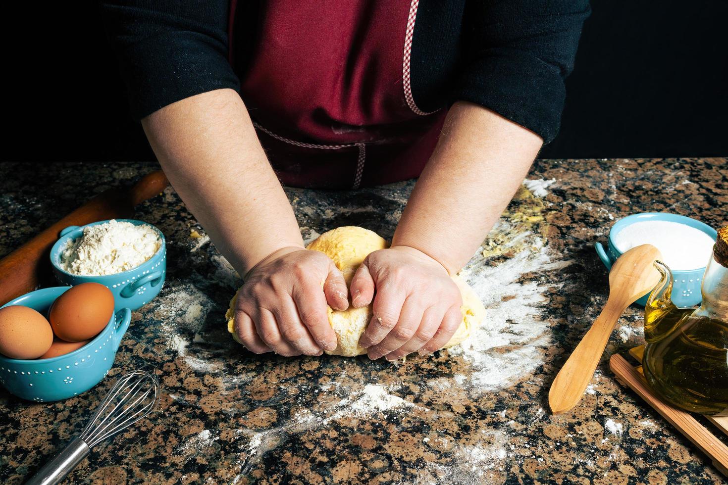 Person kneading dough for pasta photo