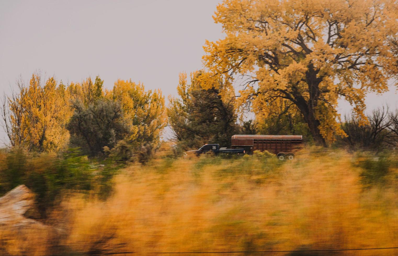 Truck with trailer in motion photo