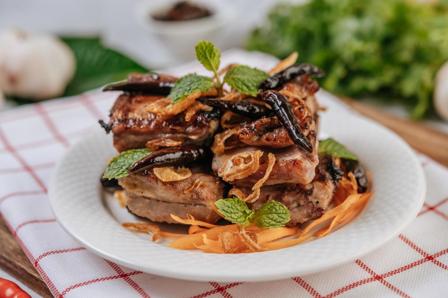 Fried pork with fried chili fried onion and mint photo