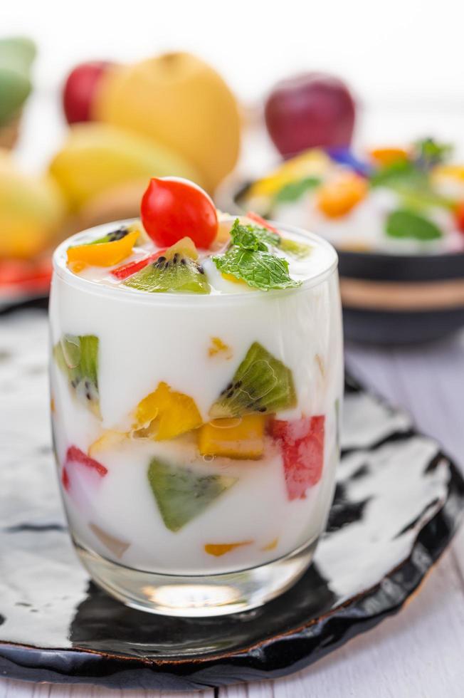 Fruit yogurt smoothie in clear glass photo