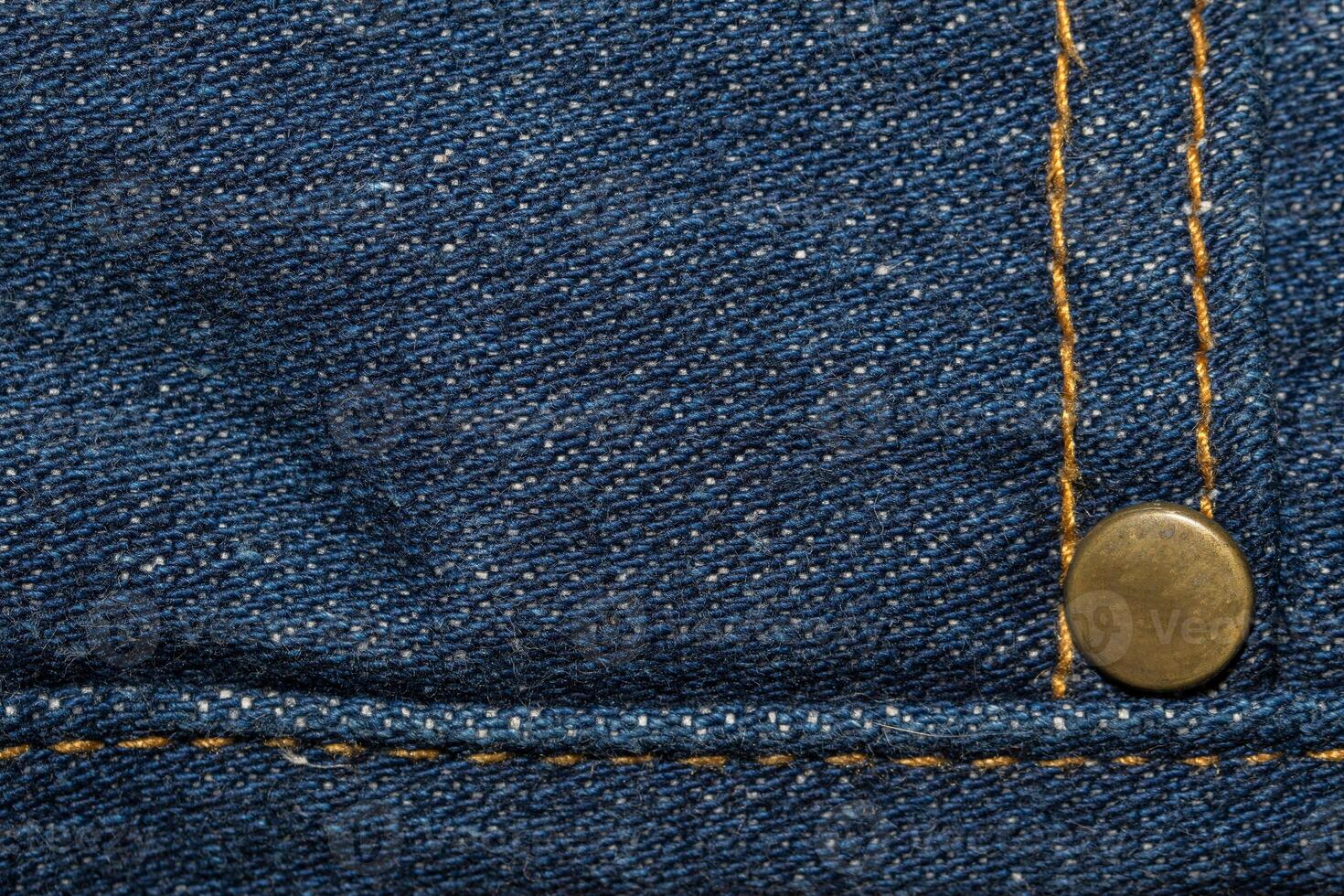 A close up of a pair of jeans with a button photo