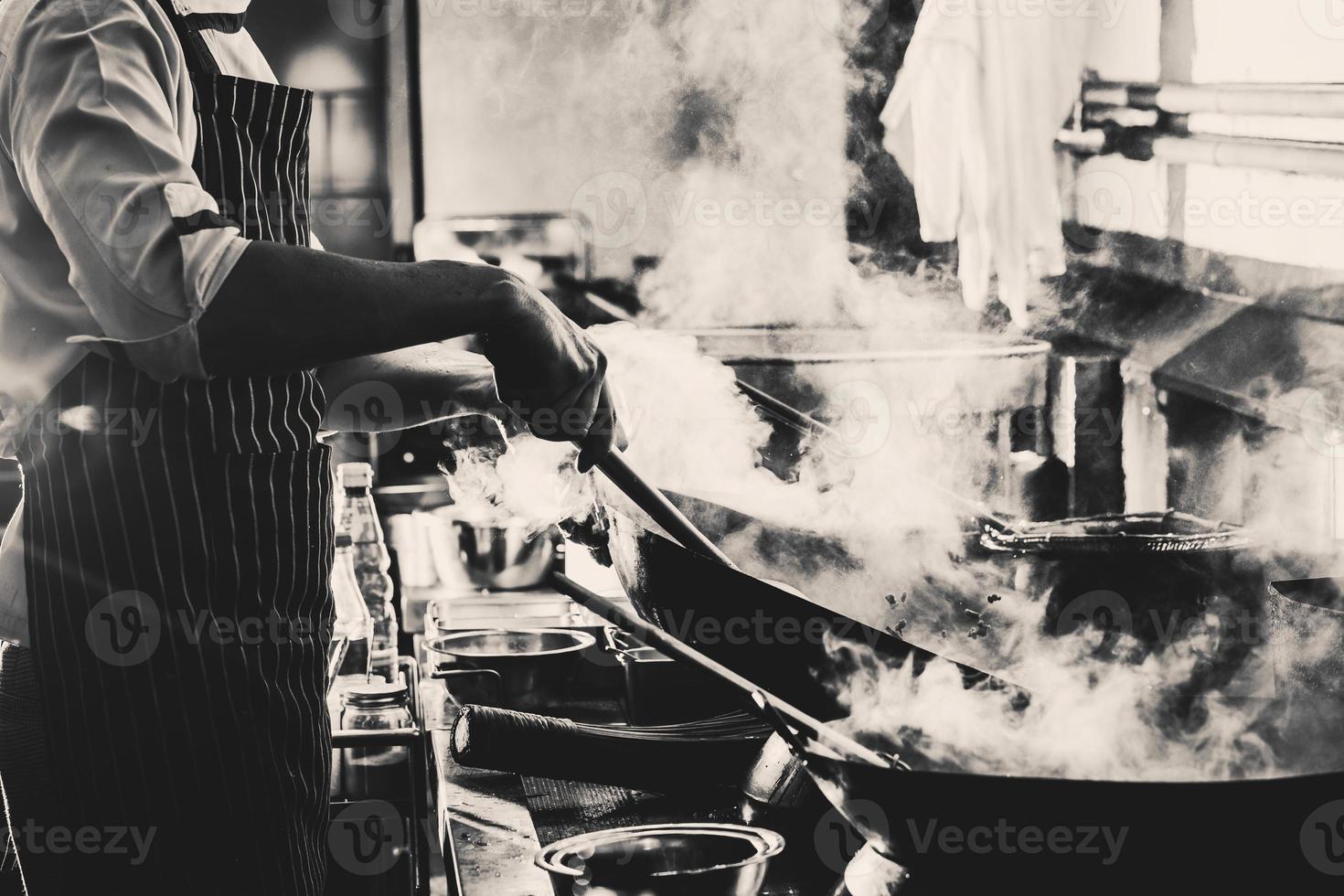 Greyscale photo of smoky kitchen