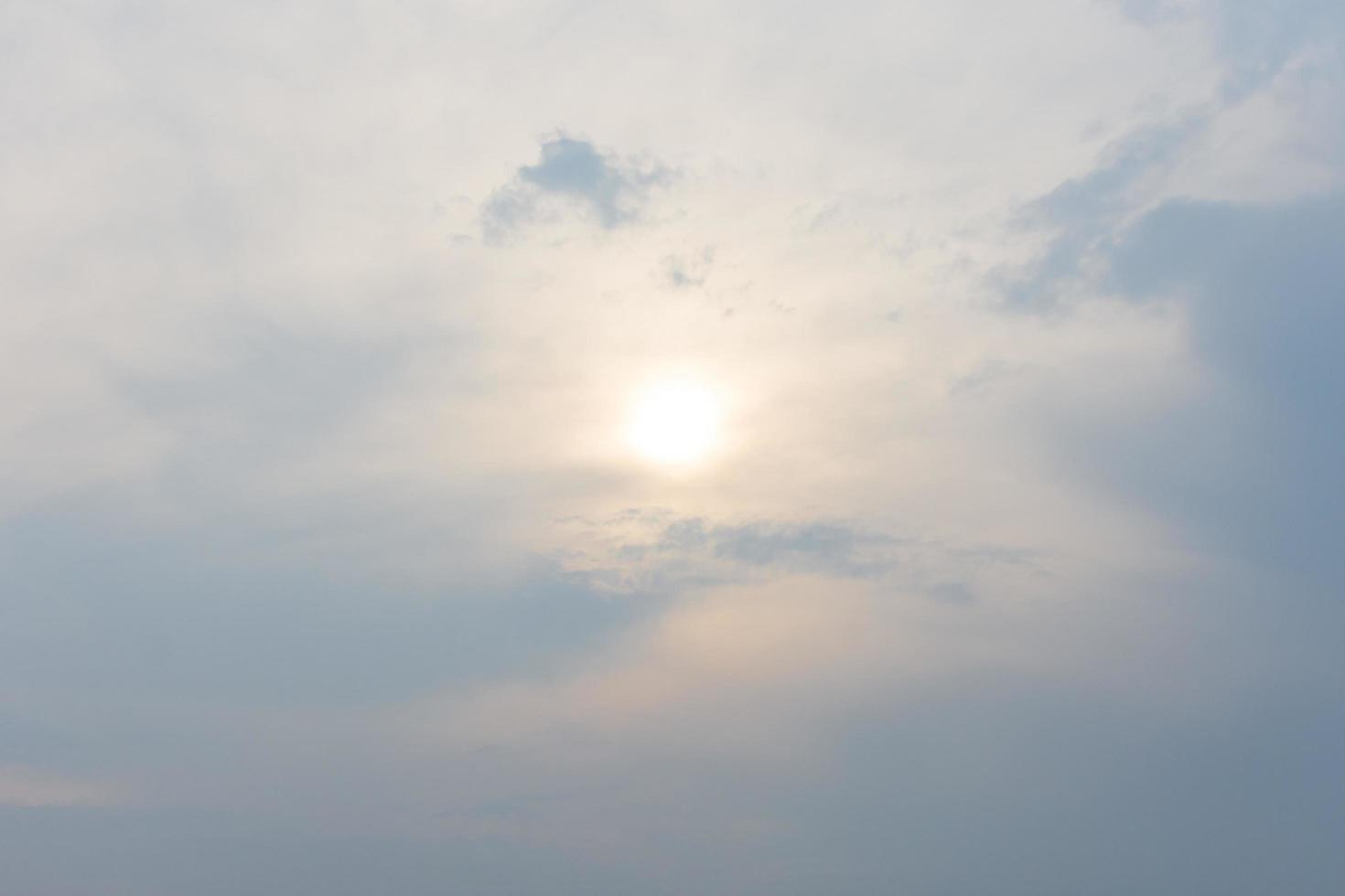 Warm cloudy sky nature background blurring, warm colors and bright sunlight. photo