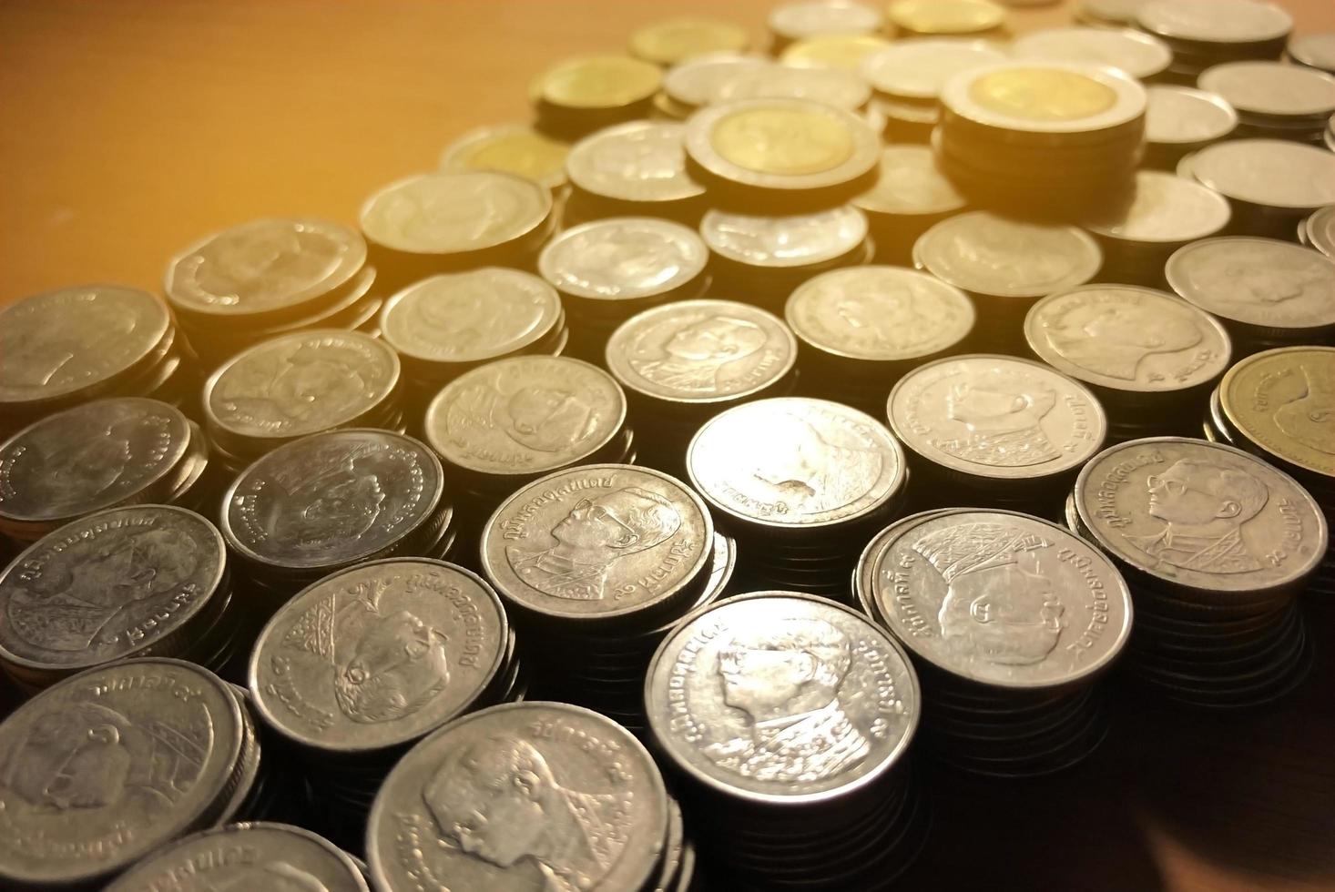 Thai Baht coins stack with soft light background. Thai coin in concept of finance, Safe money. photo