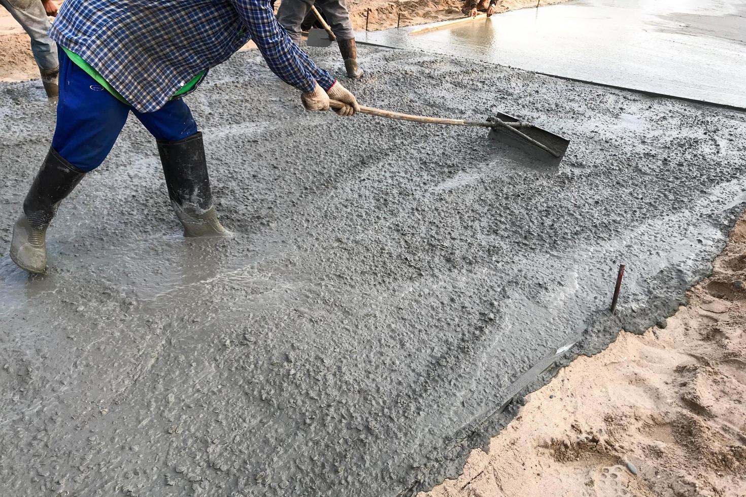 Person smoothing cement photo