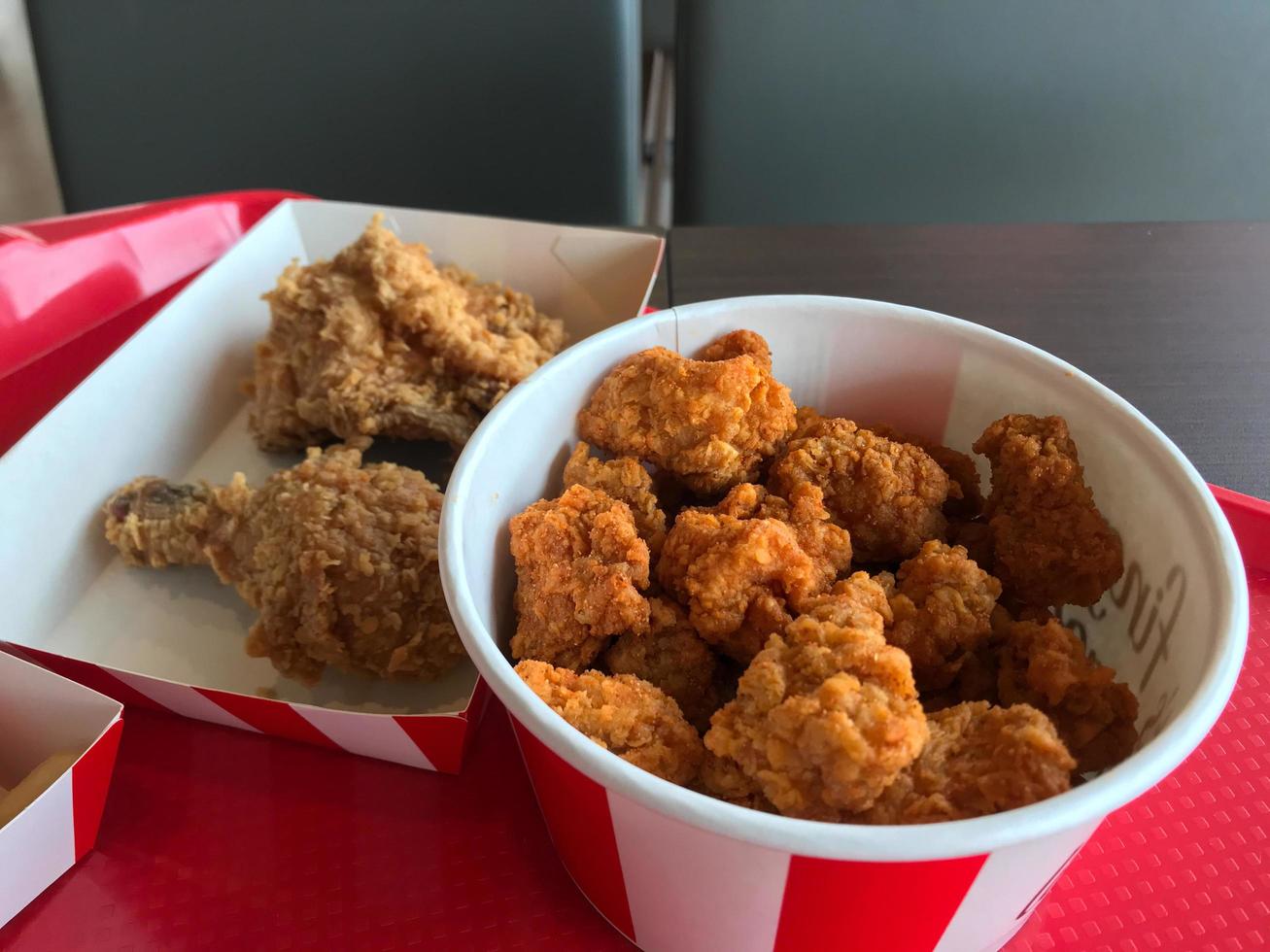 Bucket with fried chicken in it photo