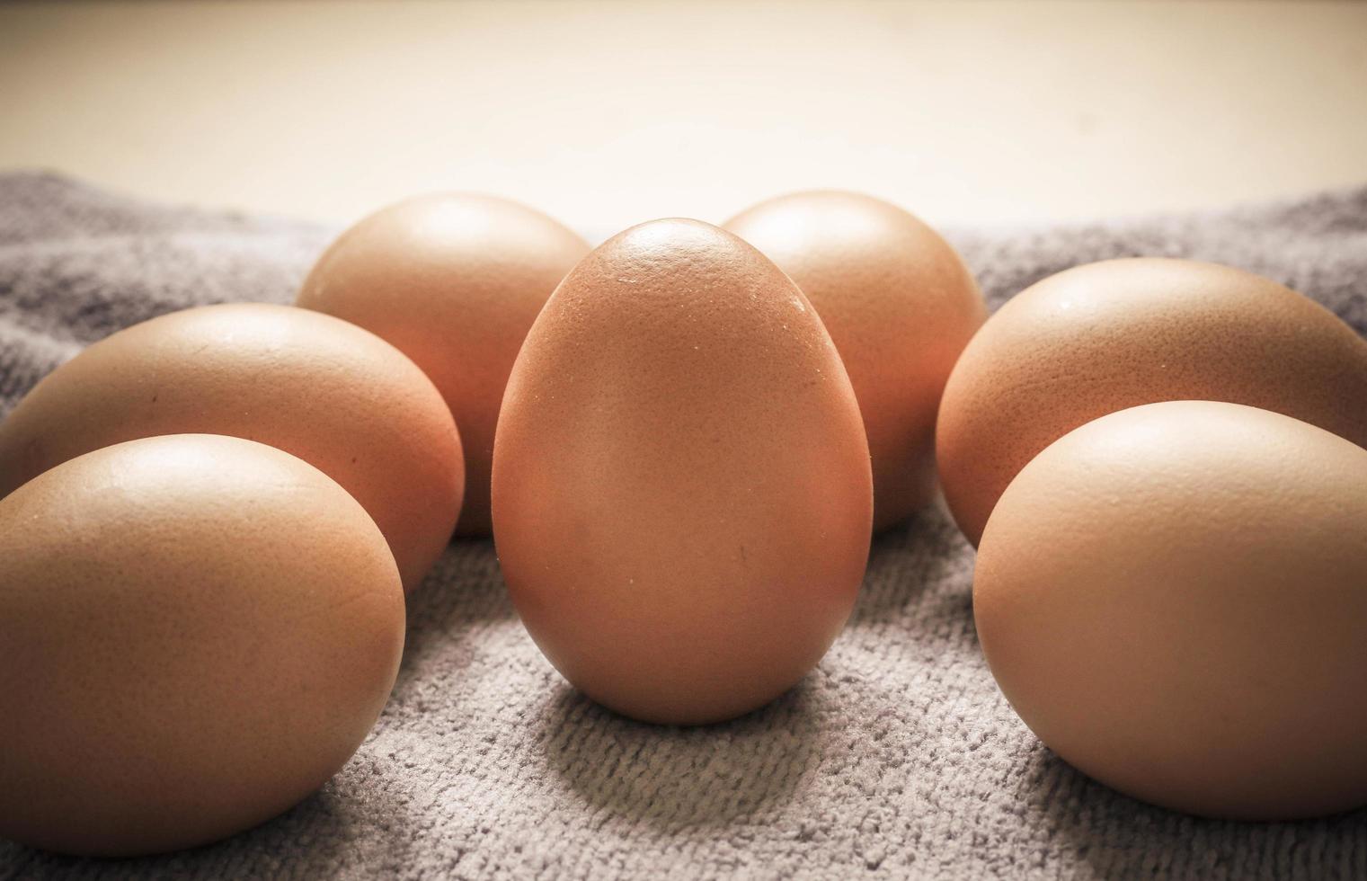 Brown eggs on a cloth photo