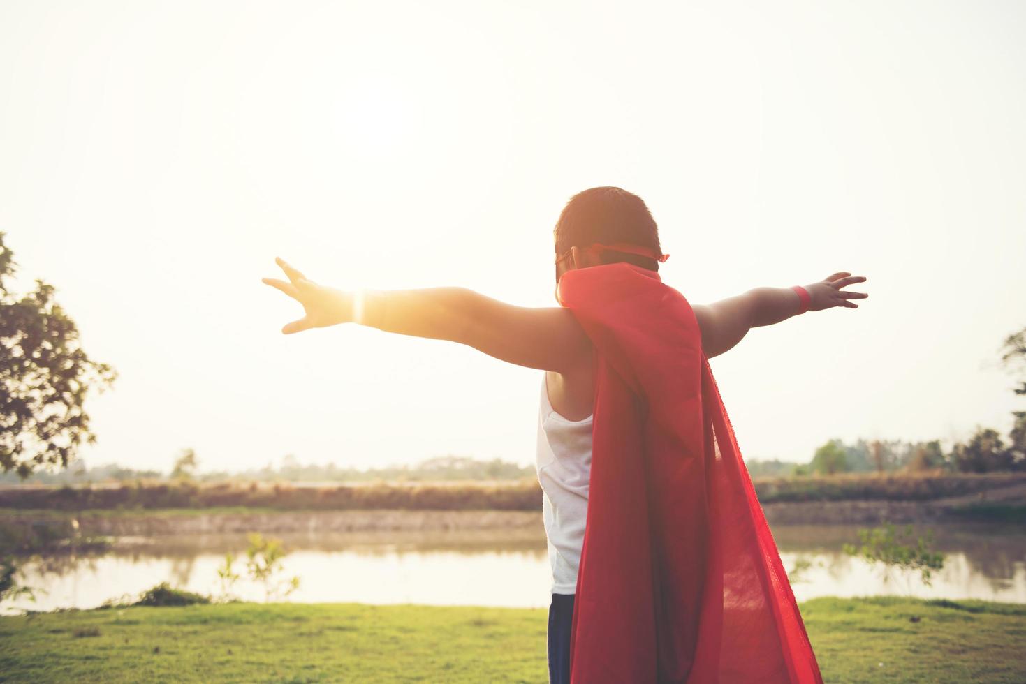 Super boy showing his powerful flying arms photo