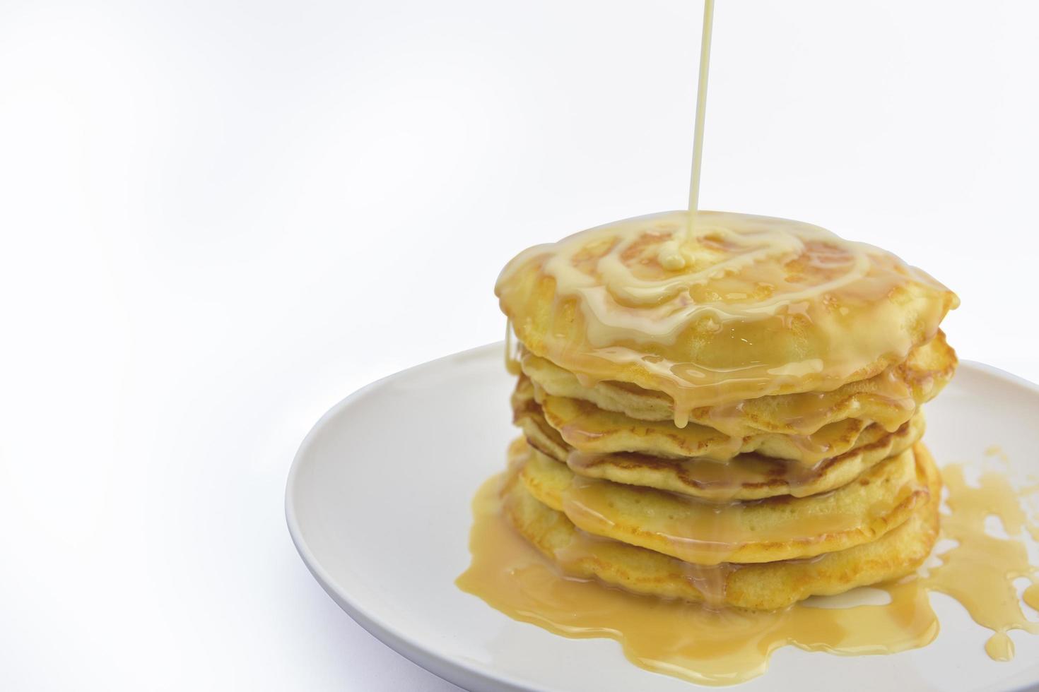 Pancake with condensed milk topping photo