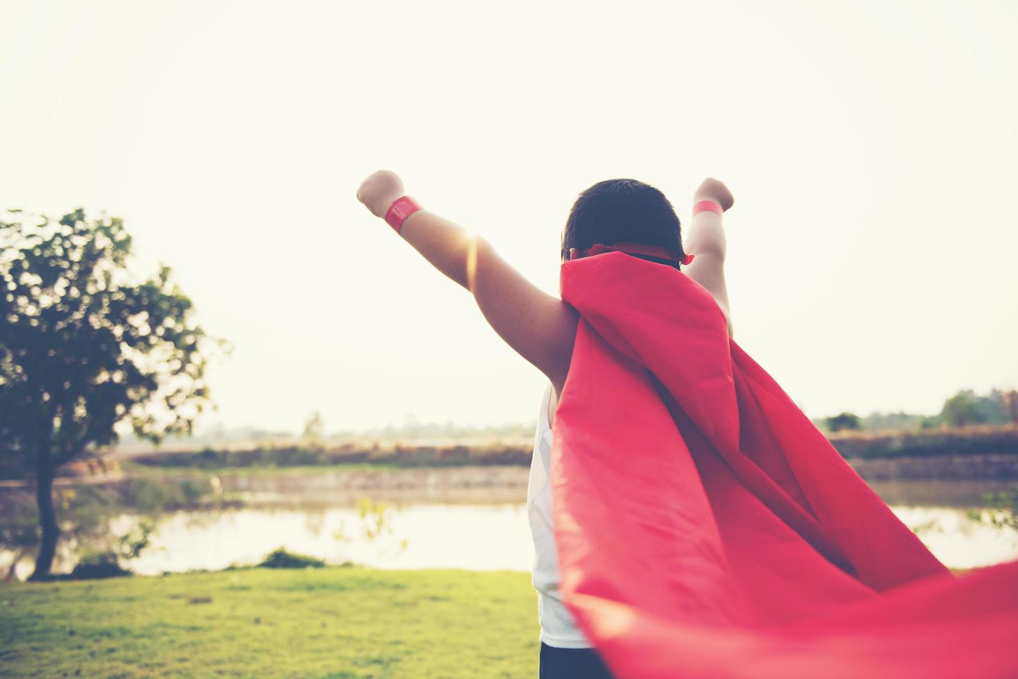 Super boy showing his powerful flying arms photo