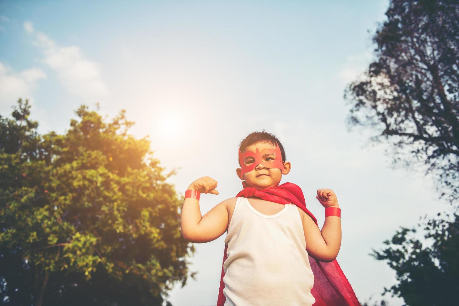 Super boy showing his powerful flying arms photo