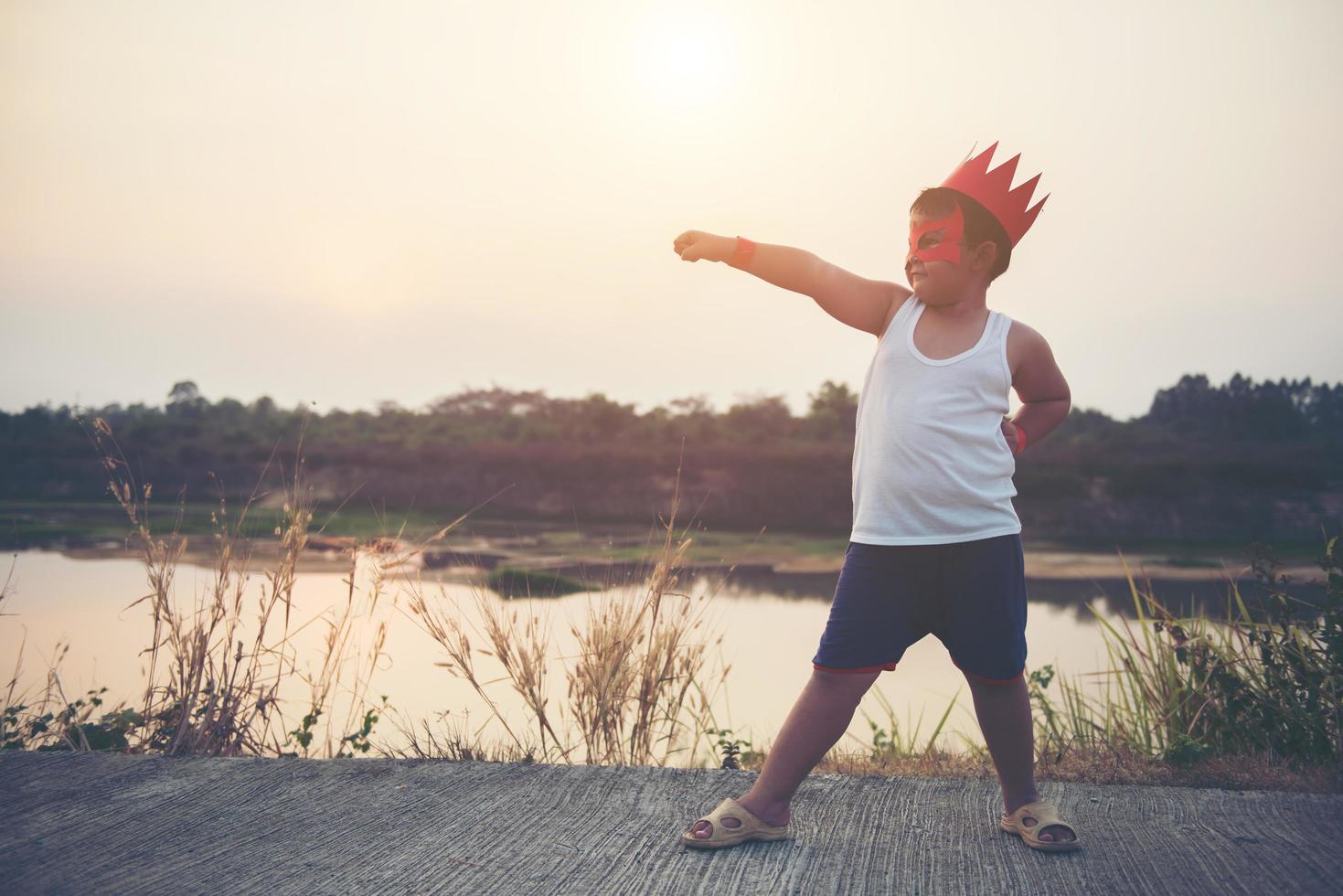 Super boy showing his powerful flying arms photo