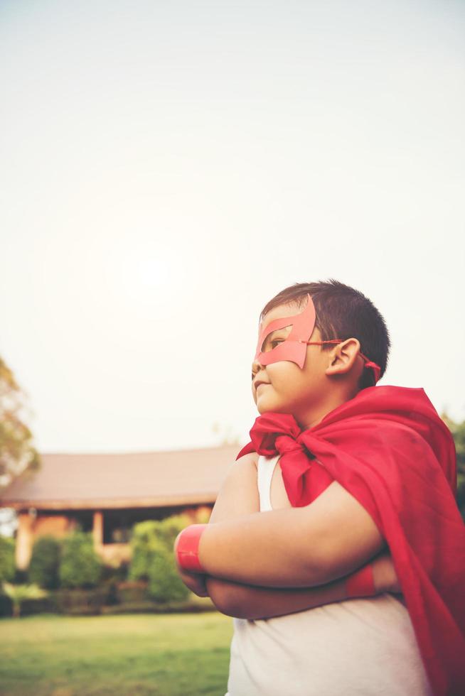 Super boy showing his powerful flying arms photo