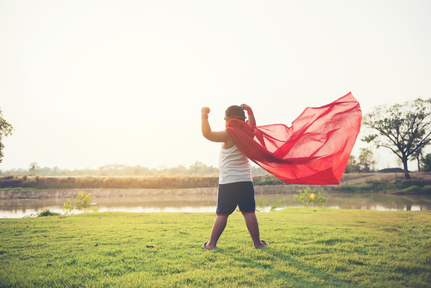 Super boy showing his powerful flying arms photo