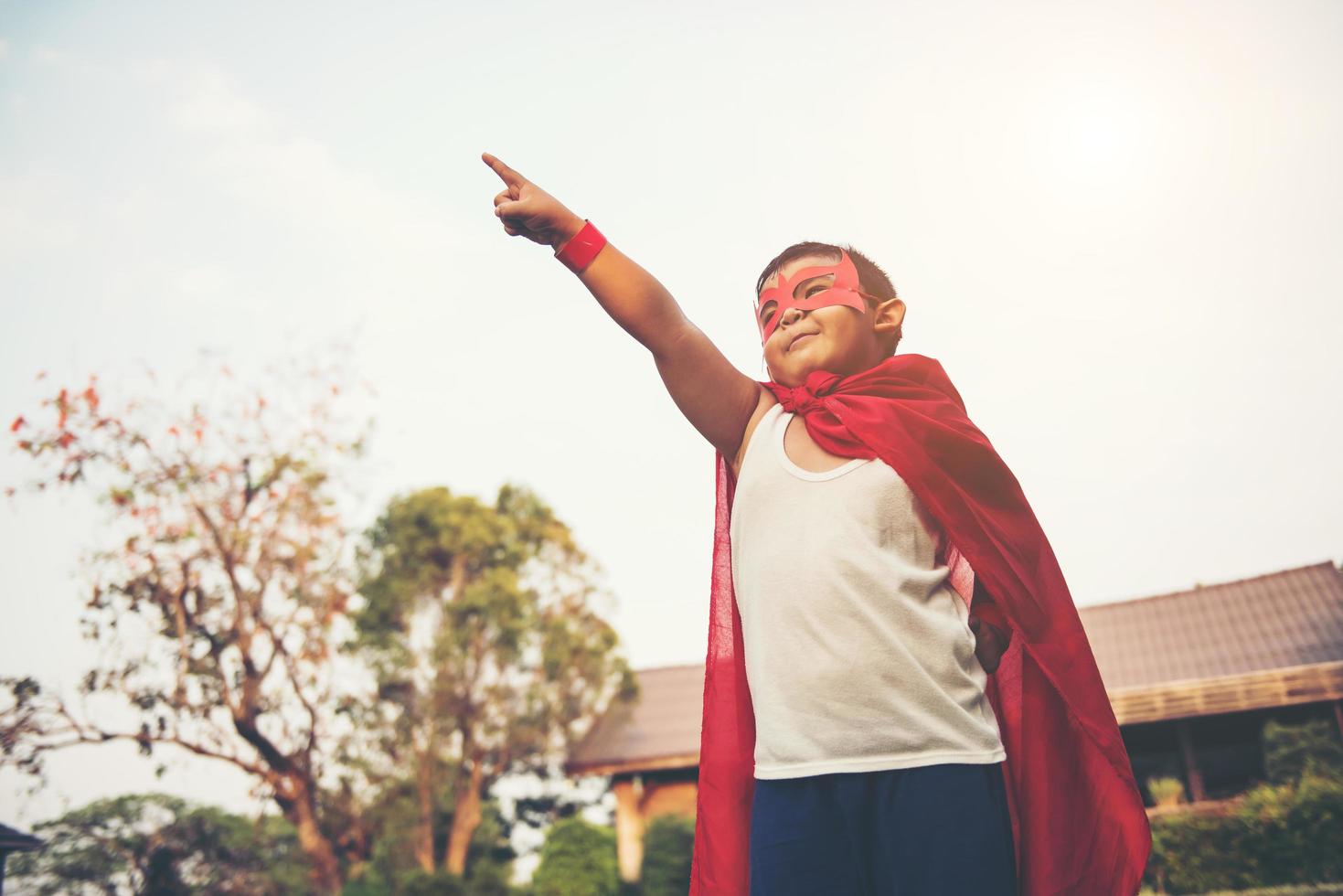 Super boy showing his powerful flying arms photo