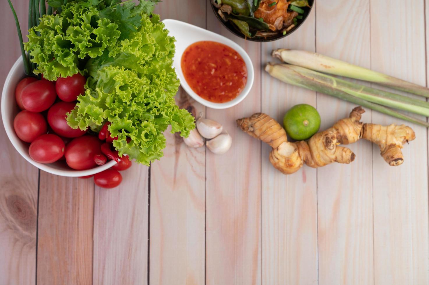 Dipping sauce with lemongrass, garlic, lime and tomato photo