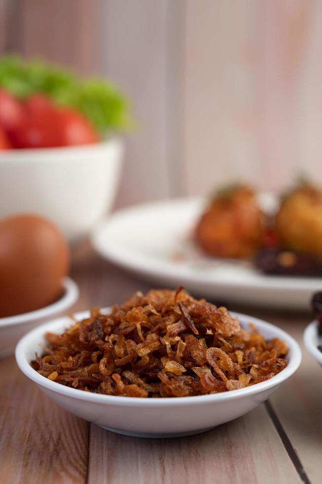 A bowl of fried onions photo