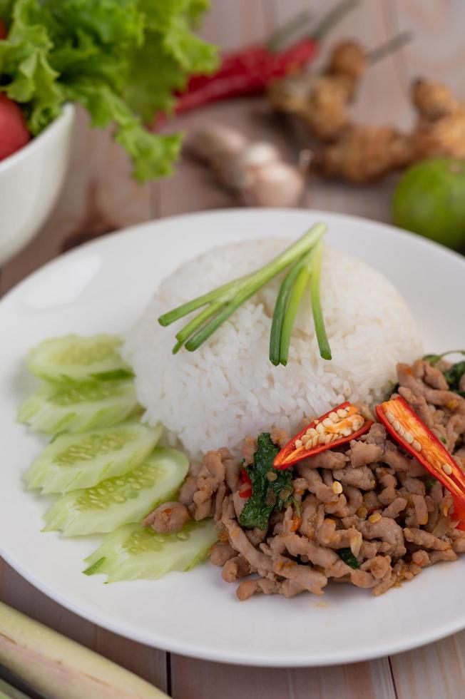 Stir fried pork with basil and fried egg photo