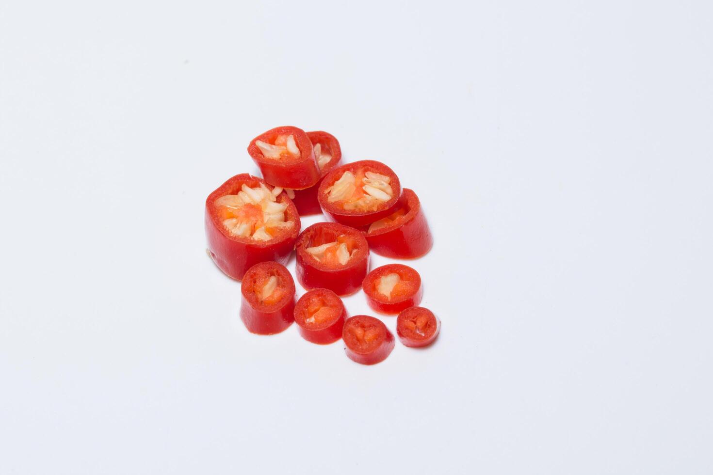 Chili, sliced on white background photo