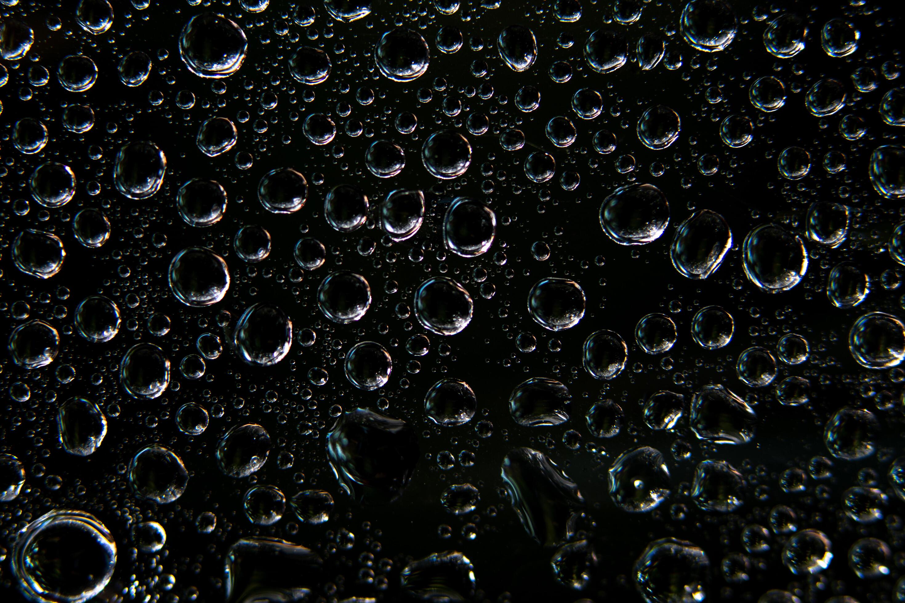 Water droplets on black background 1864129 Stock Photo at Vecteezy