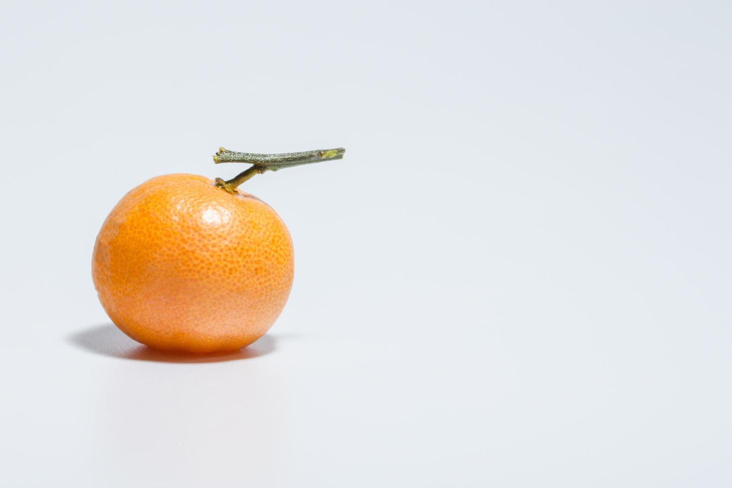 Orange on white background photo