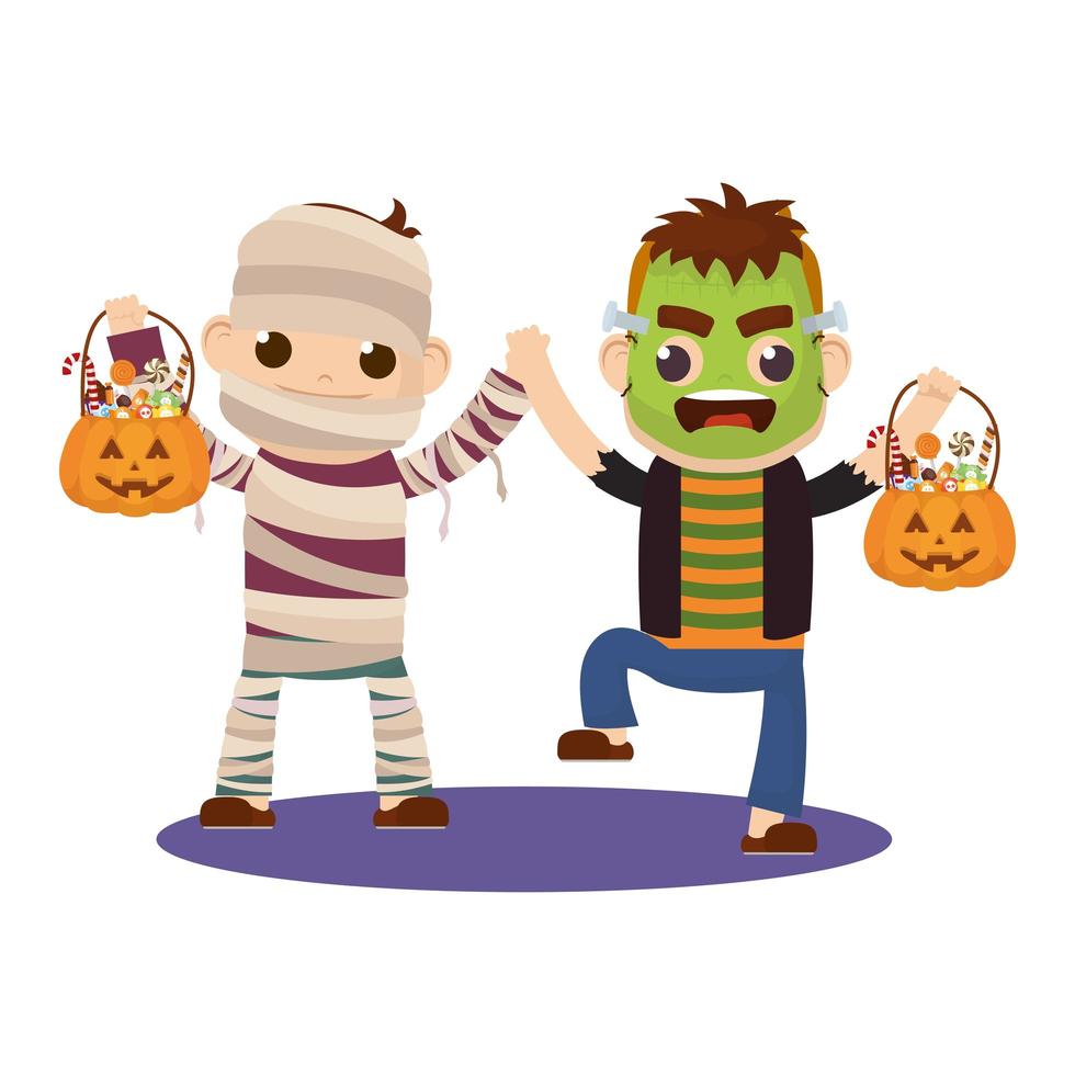 niños pequeños en disfraces de halloween vector