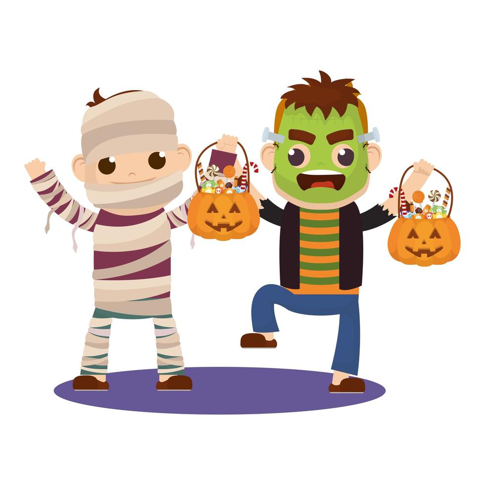 niños pequeños en disfraces de halloween vector