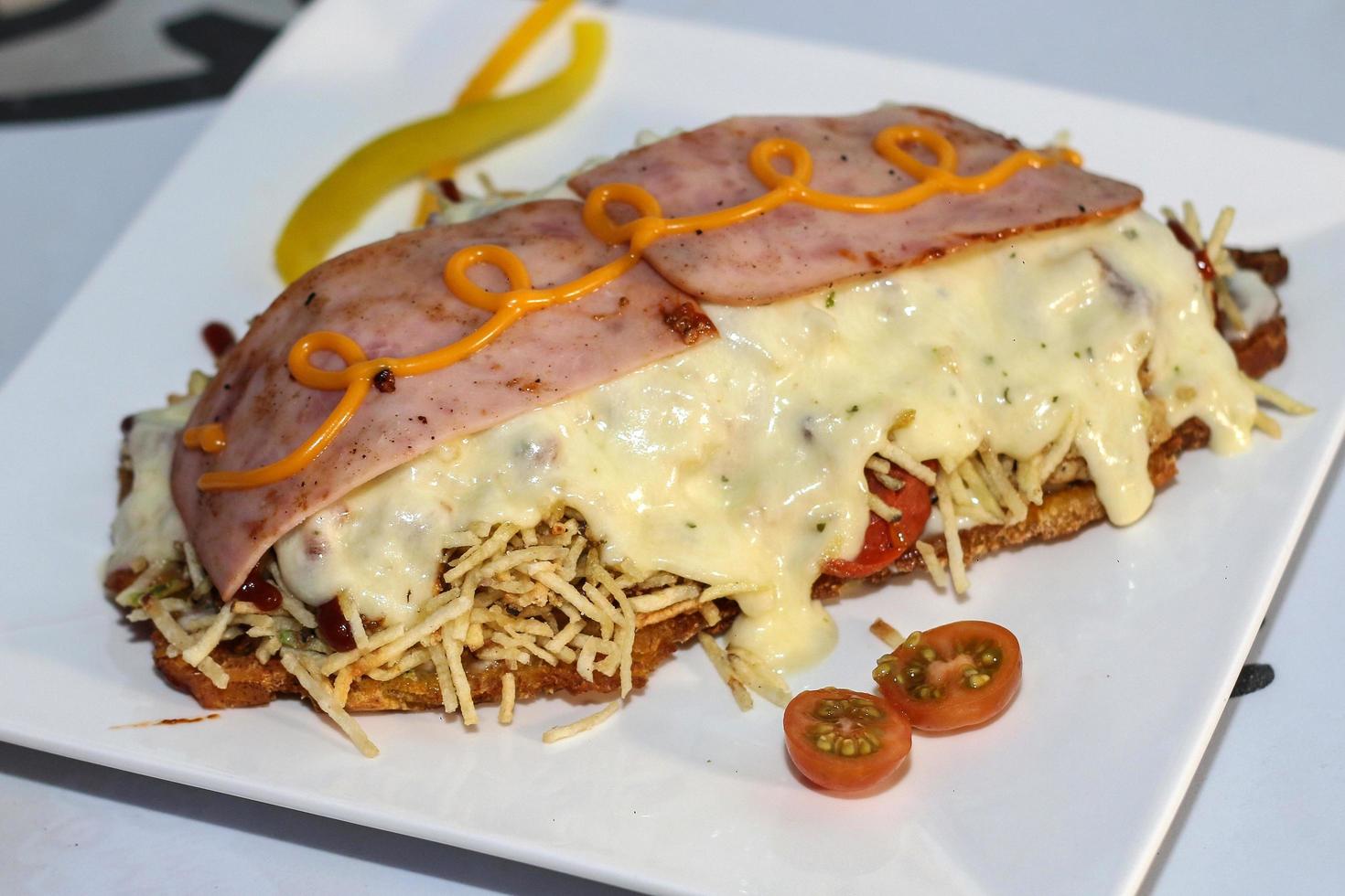 fast fast food patacones stuffed with cheese and ham photo