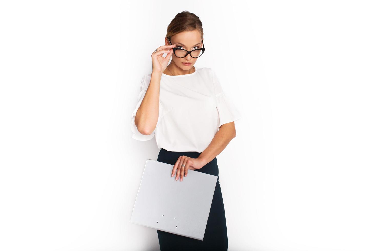 Woman holding glasses and binder photo