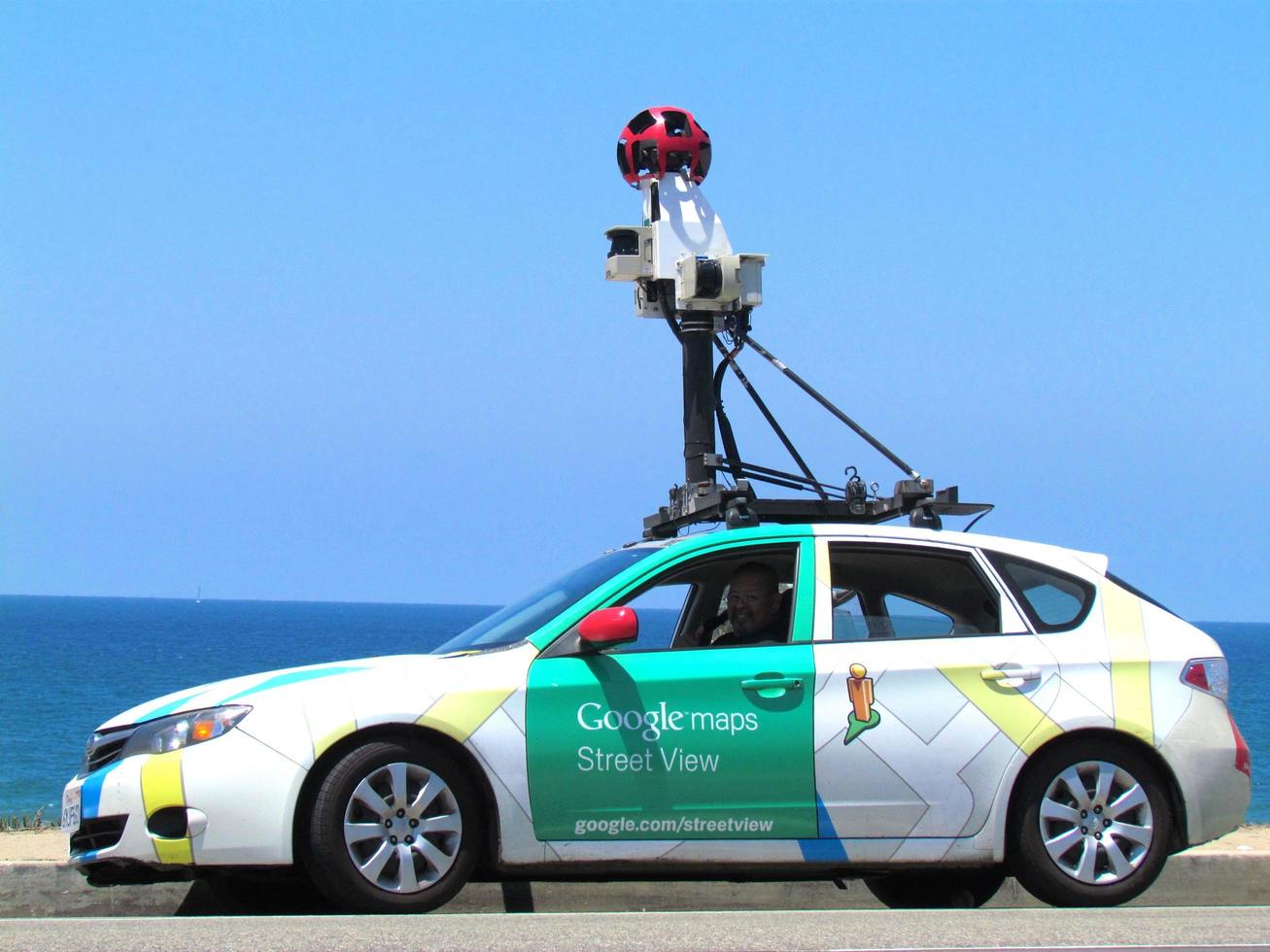 White and green Google Maps hatchback photo