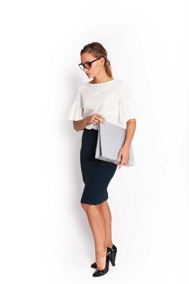 Professional woman holding binder photo