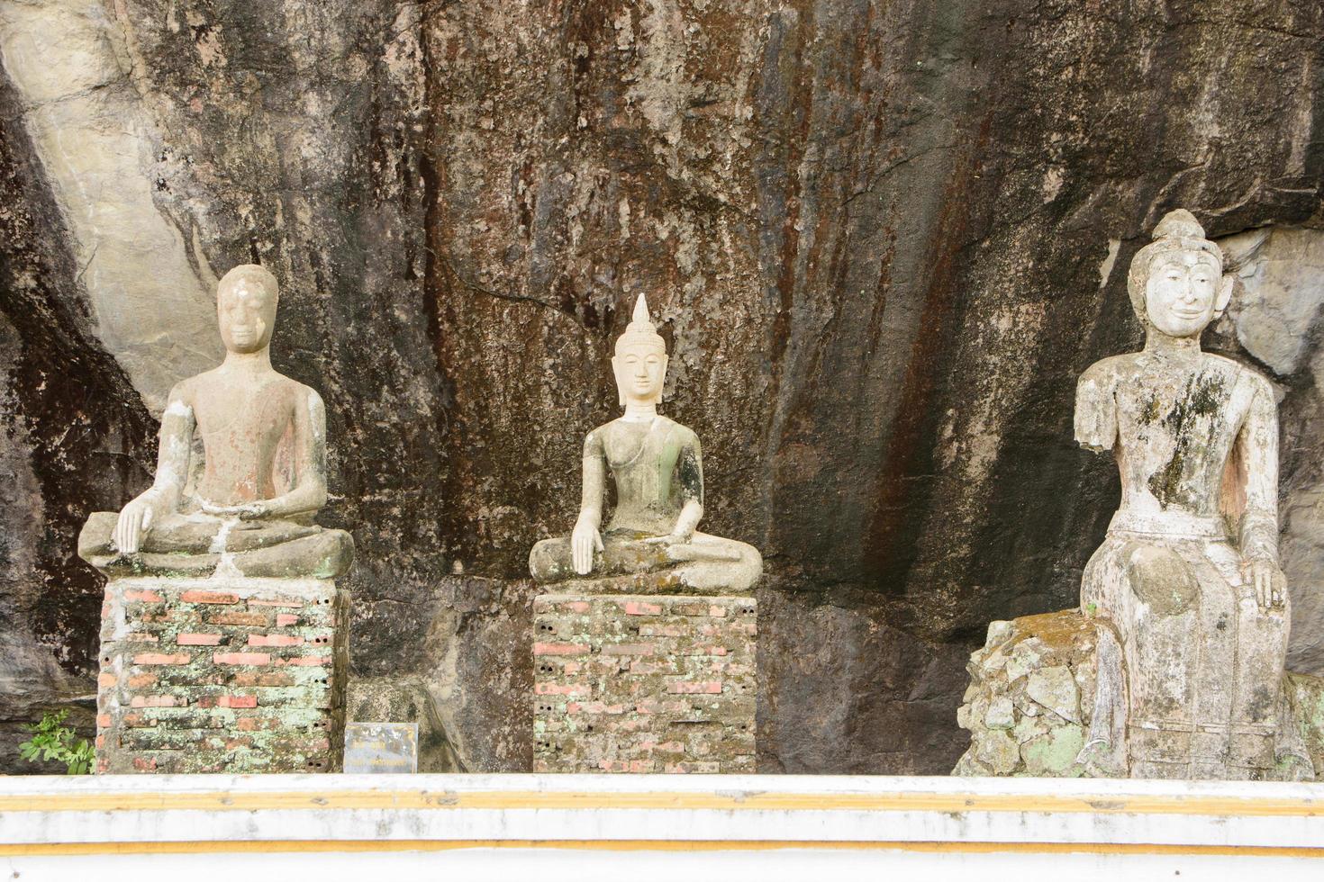 Buddha statues in the mountains photo
