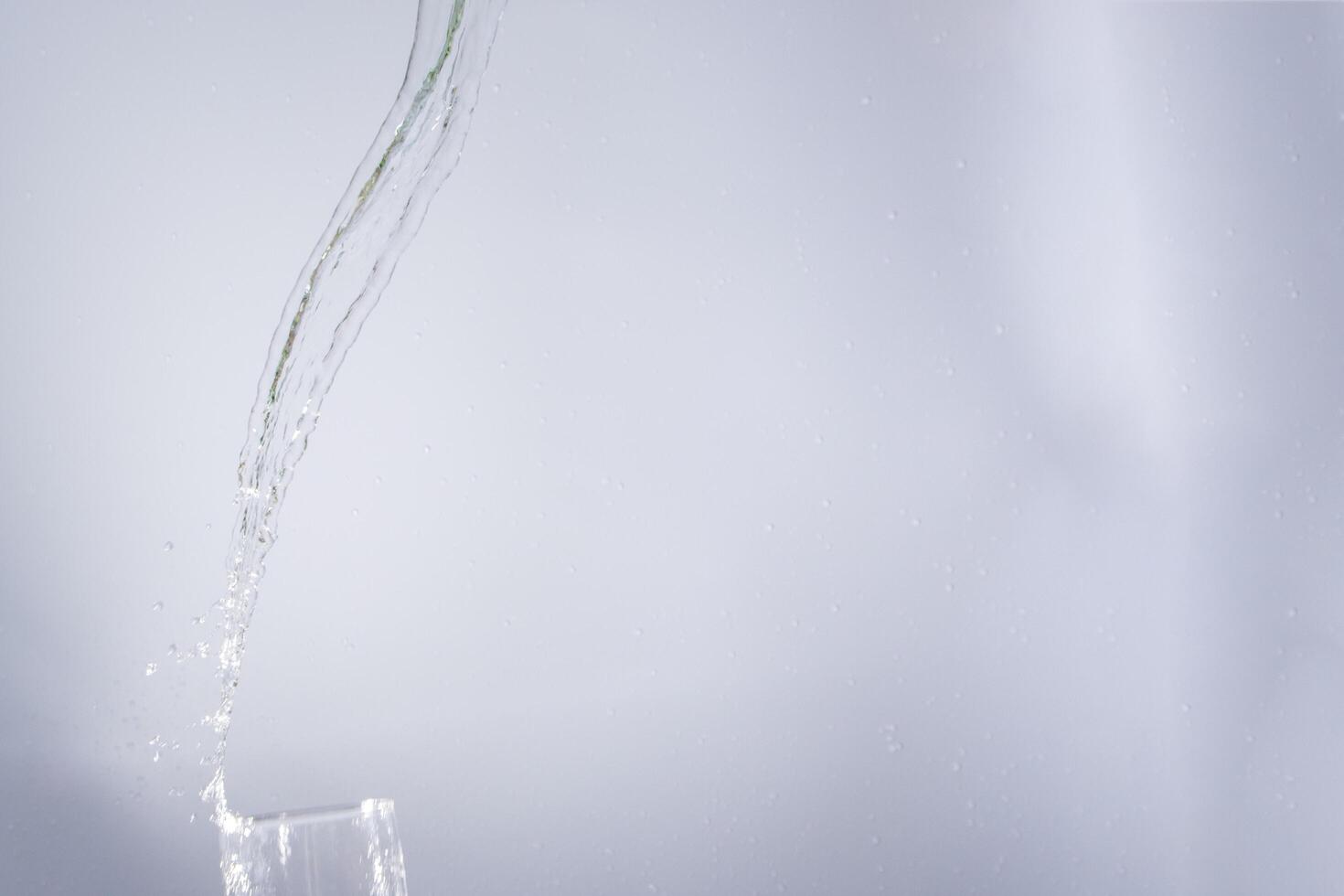 Splashing water from the glass photo