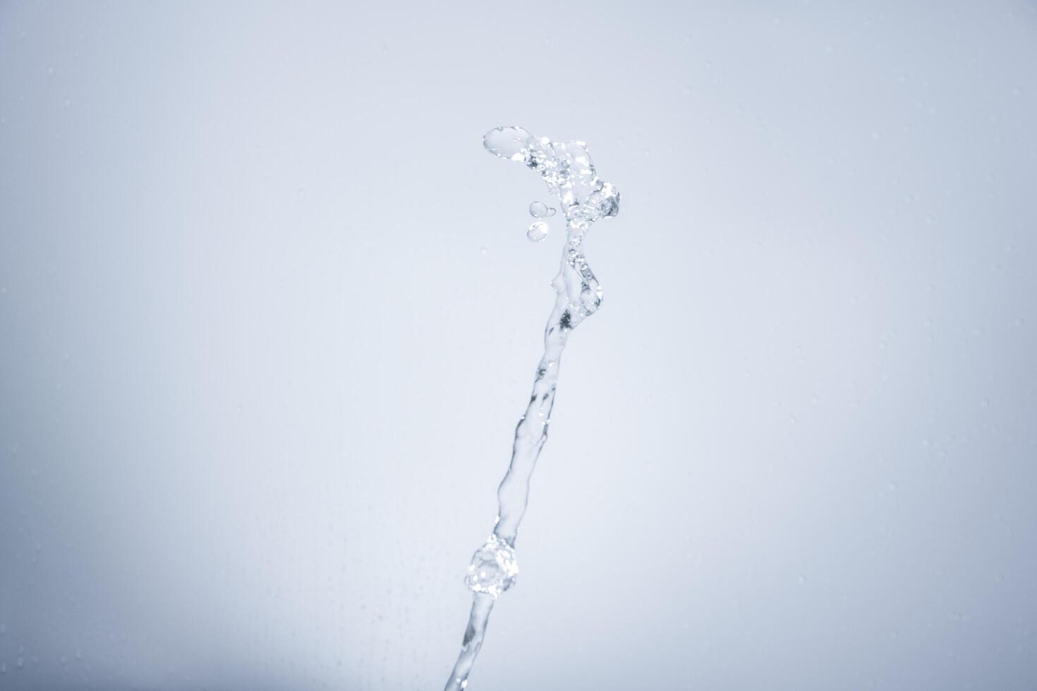 Water over grey background photo