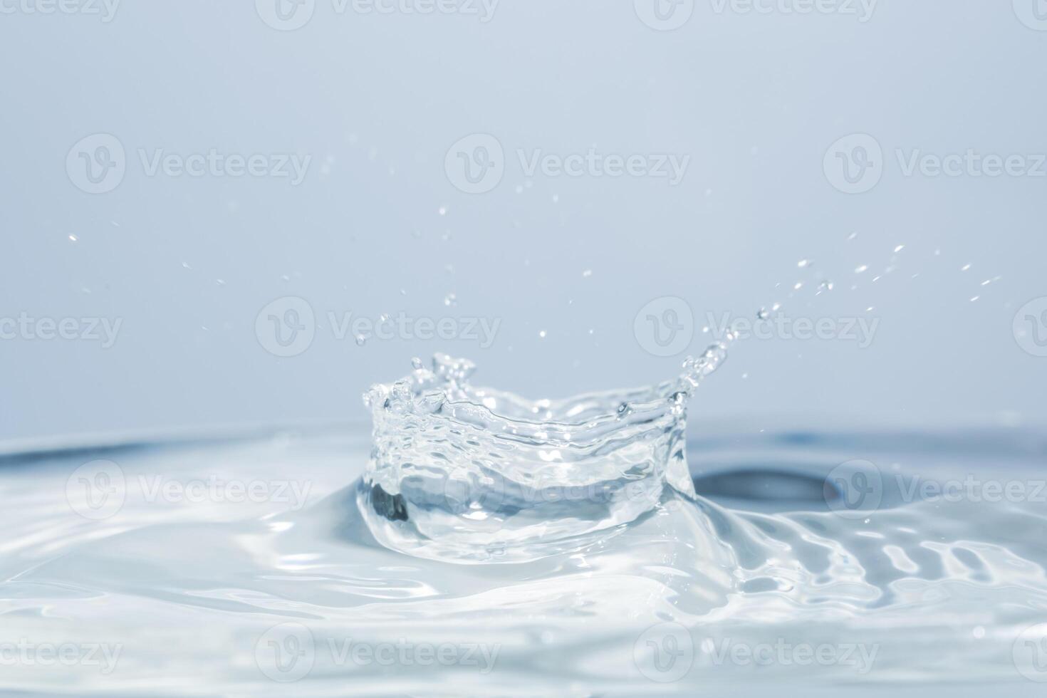 Water splash with a drop of water photo