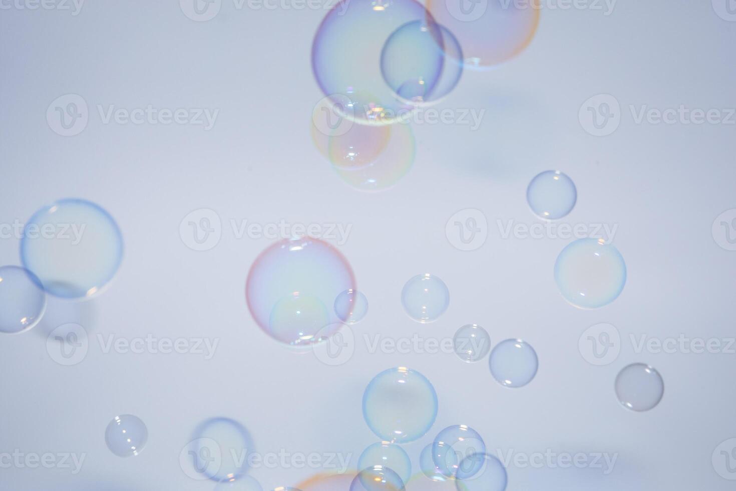 Soap bubbles floating in the air photo