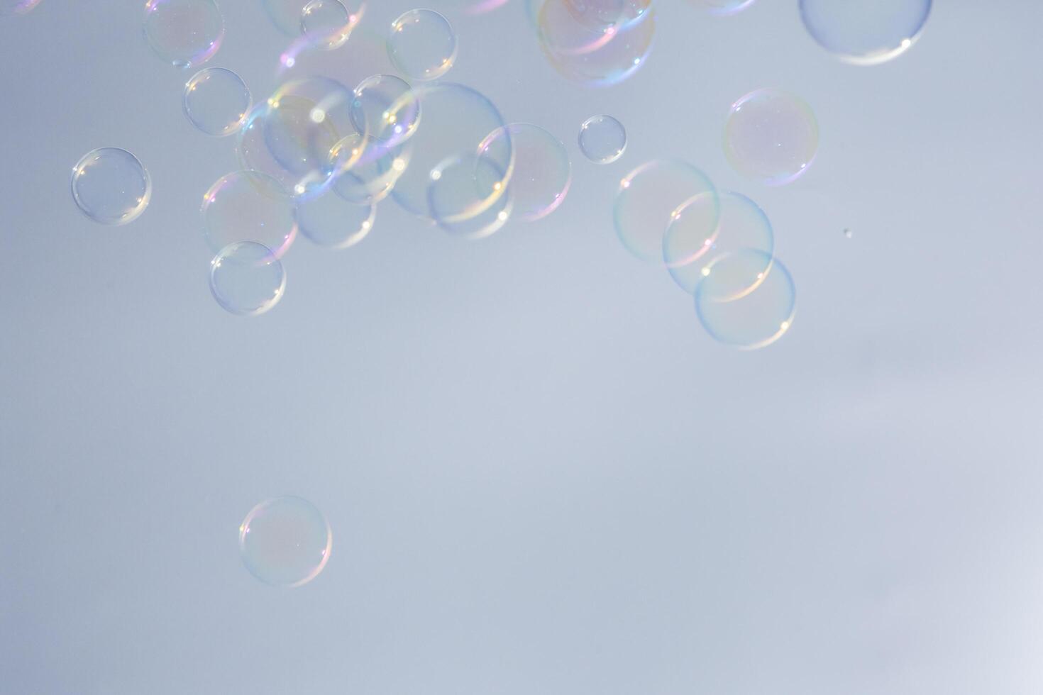 Bubbles in front of greyish-white background photo